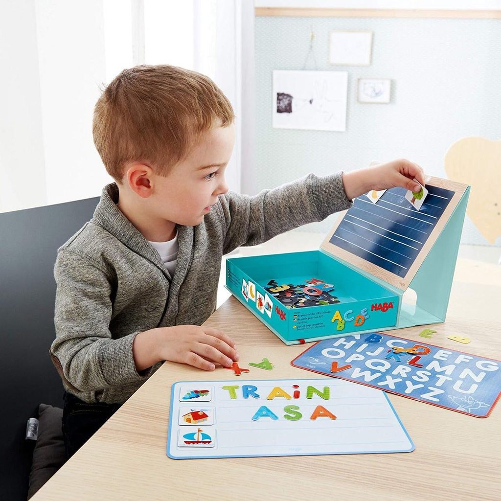 Preschool child counting colorful building blocks