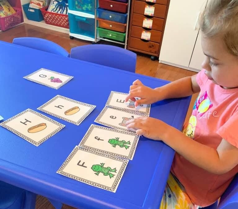Kids playing preschool matching activity in classroom